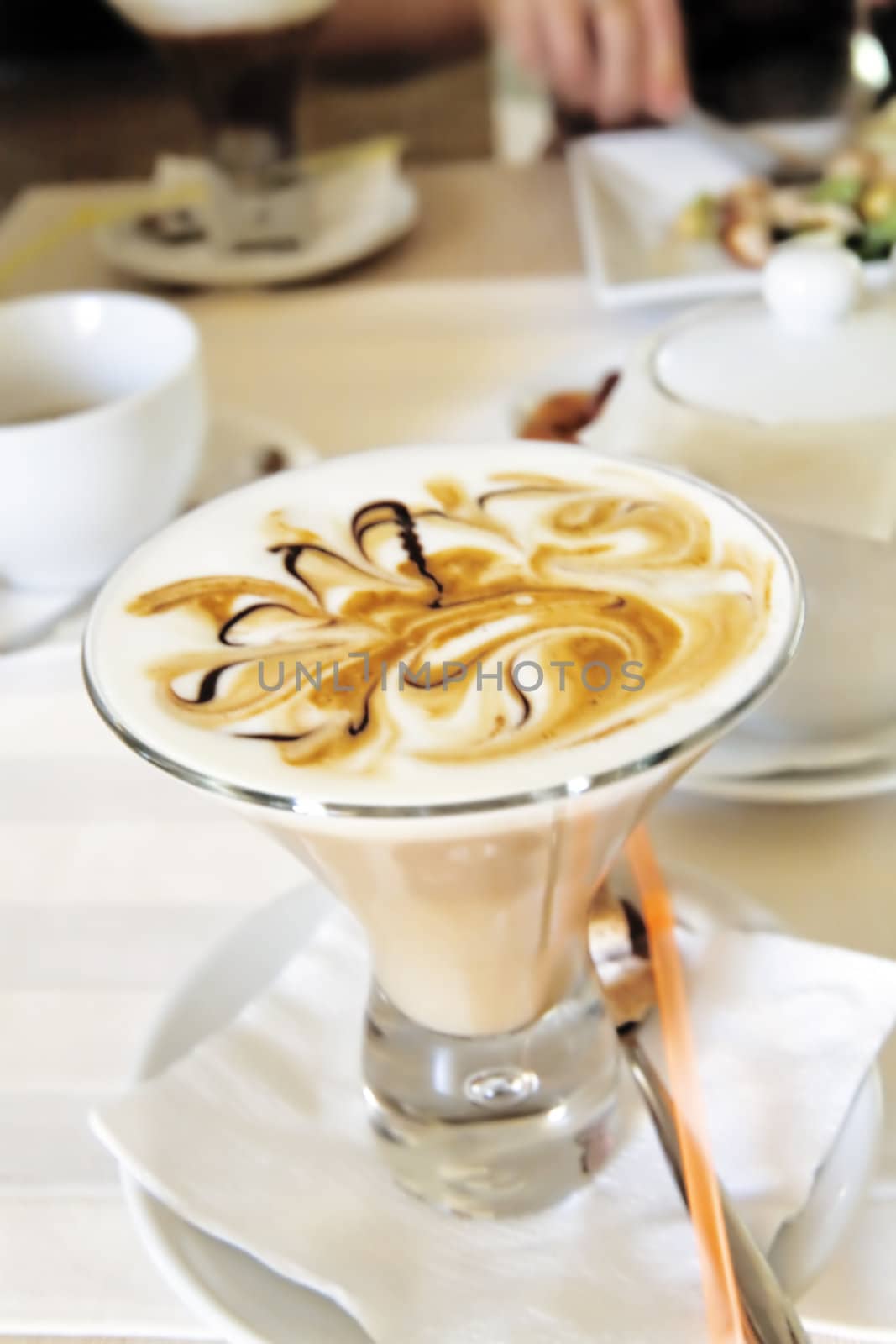 Appetizing coffee with foam in a glass