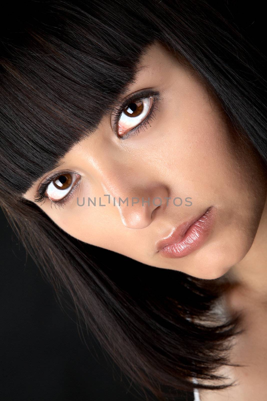 The person of the beautiful girl close up on a black background