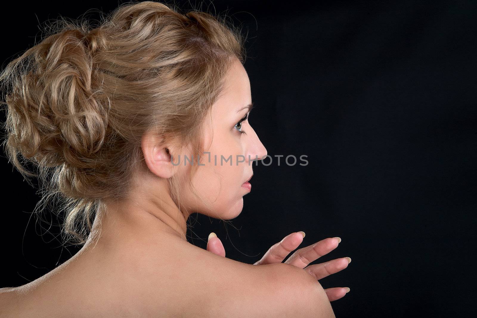 Head the girl in a profile on black background