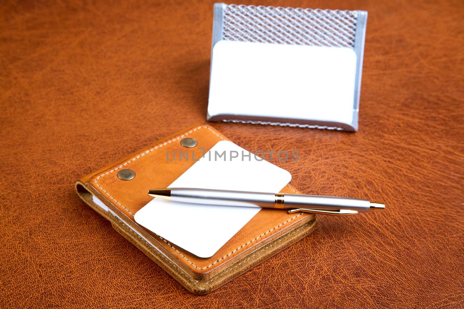 Organizer support for papers and  pen on a textural background