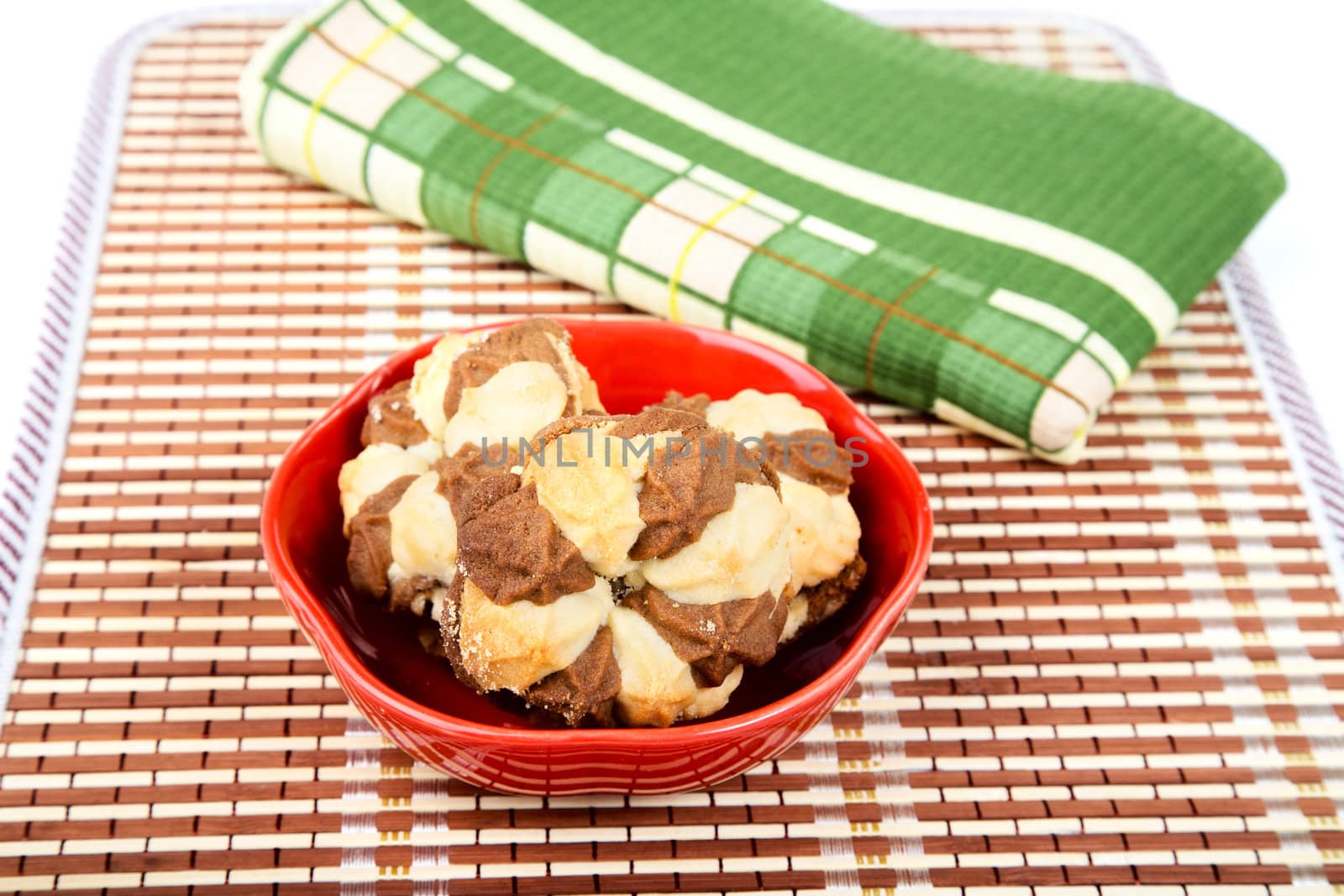 Still-life with shortcake and  towel isolated on a white background
