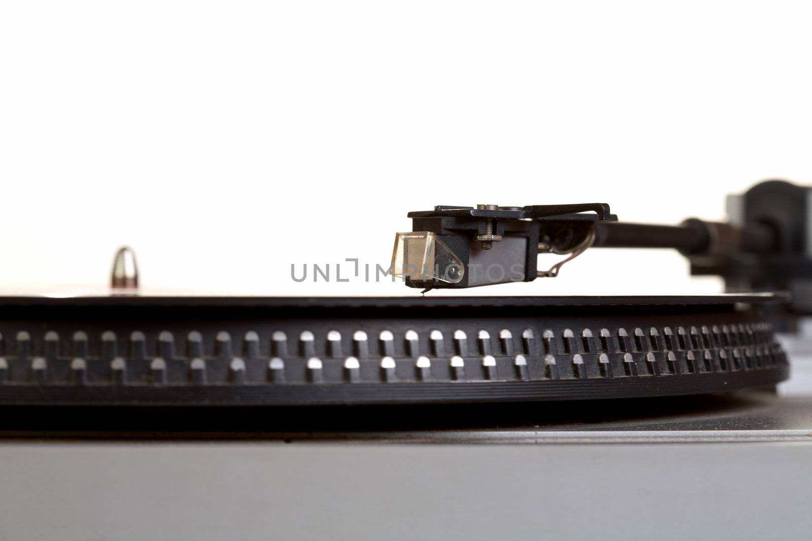 Old  player and vinyl phonograph record on a white background