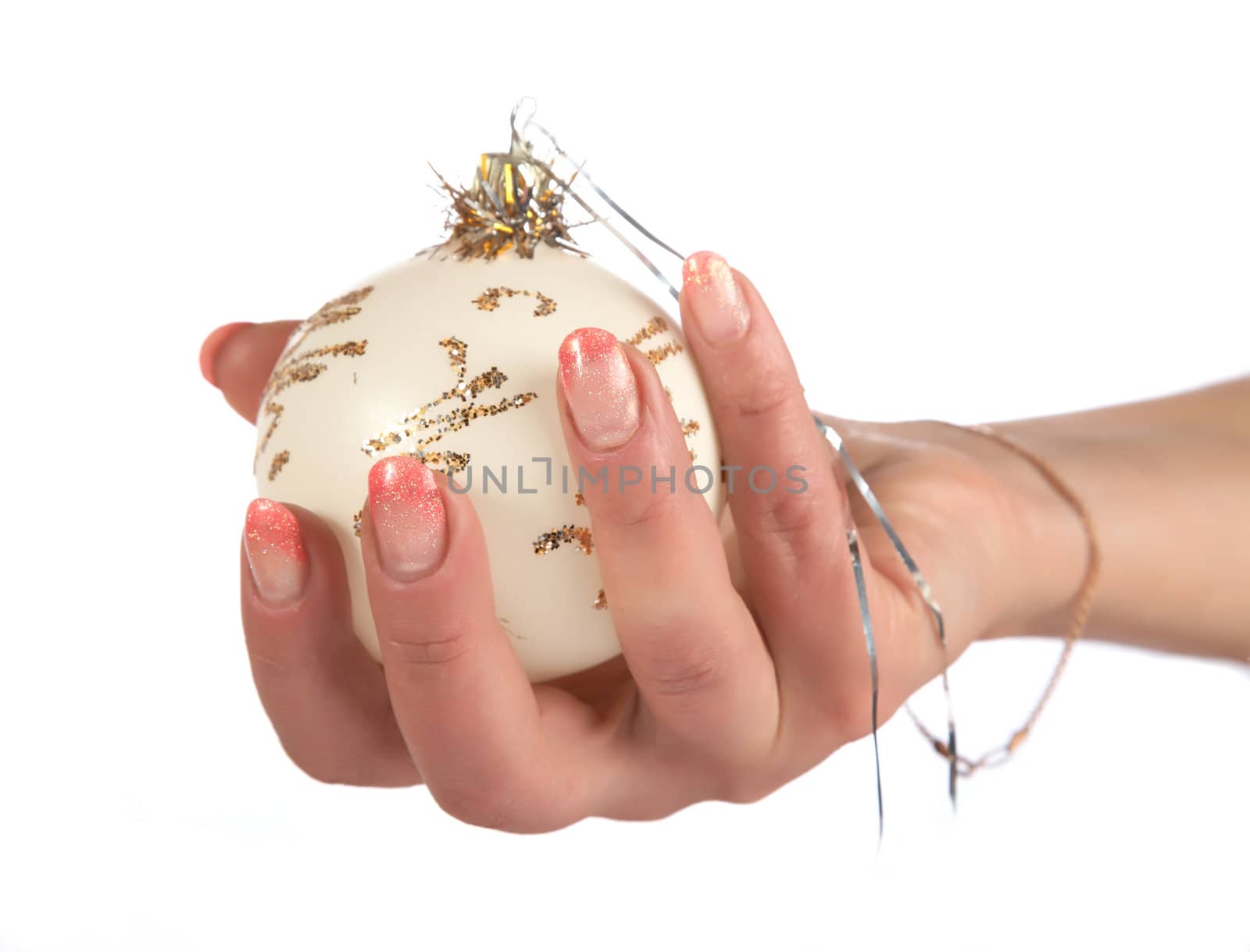Female hands hold fur-tree spheres on a white background