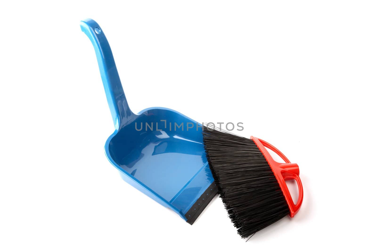 Scoop for dust and  brush on a white background