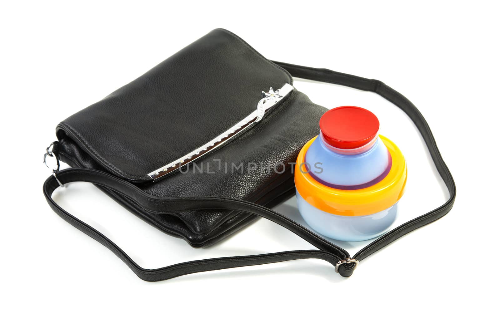 Female bag and cosmetics isolated on a white background