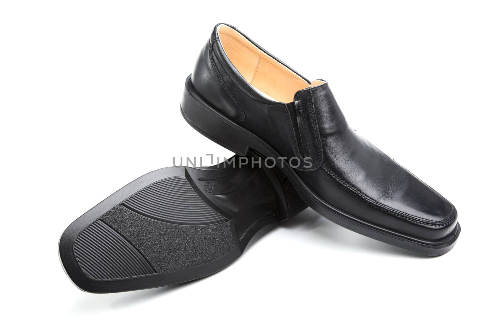 Pair of black man's shoes on a white background