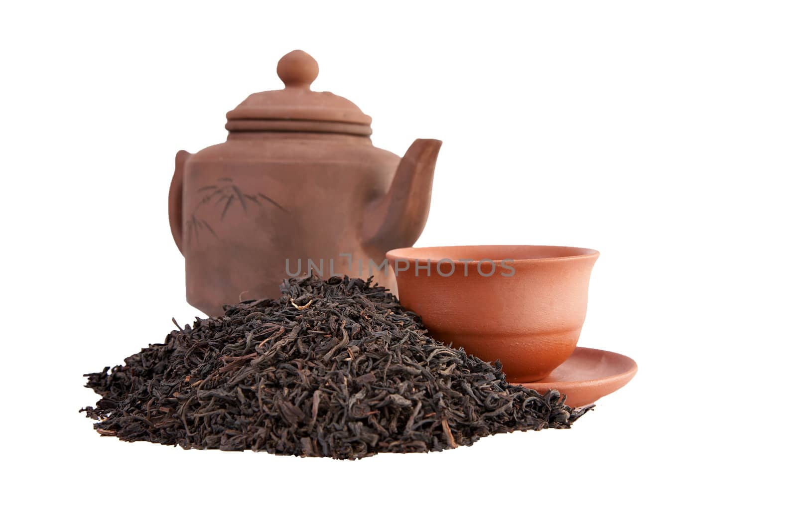 Tea a teapot and a cup on a white background