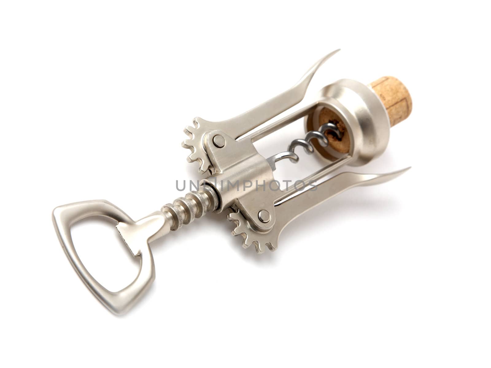 Metal corkscrew with a cork on white background