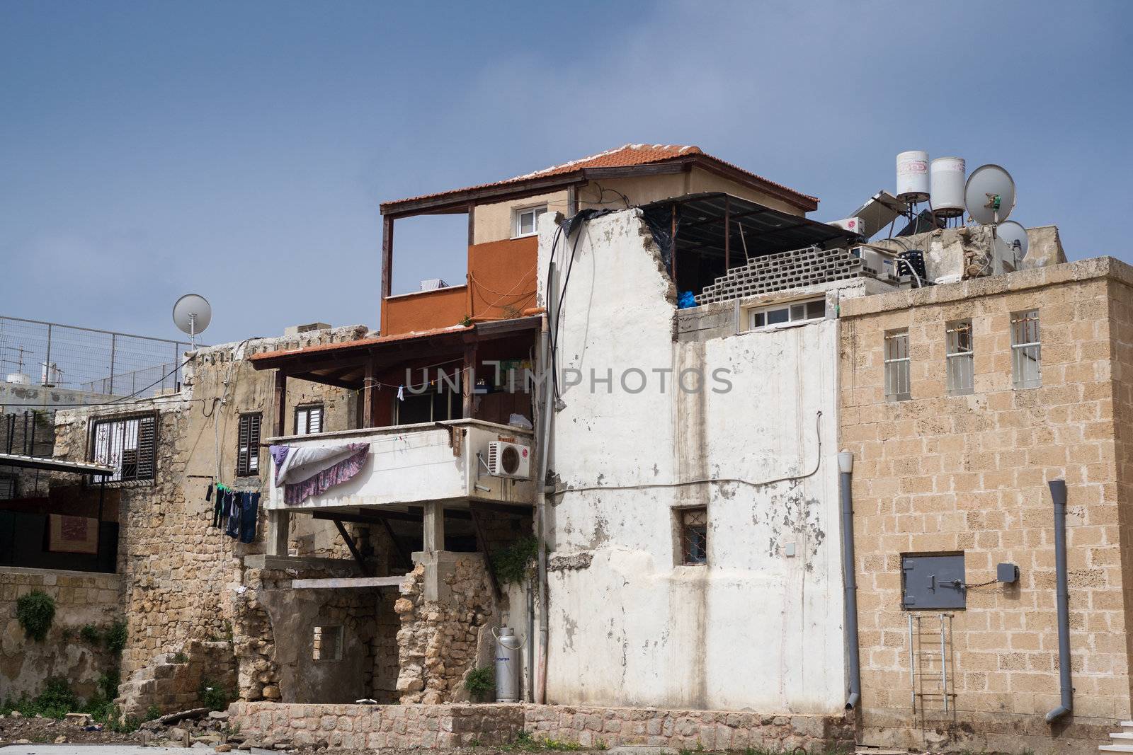 Arab house with washing on balcony in old town of Akko, Israel