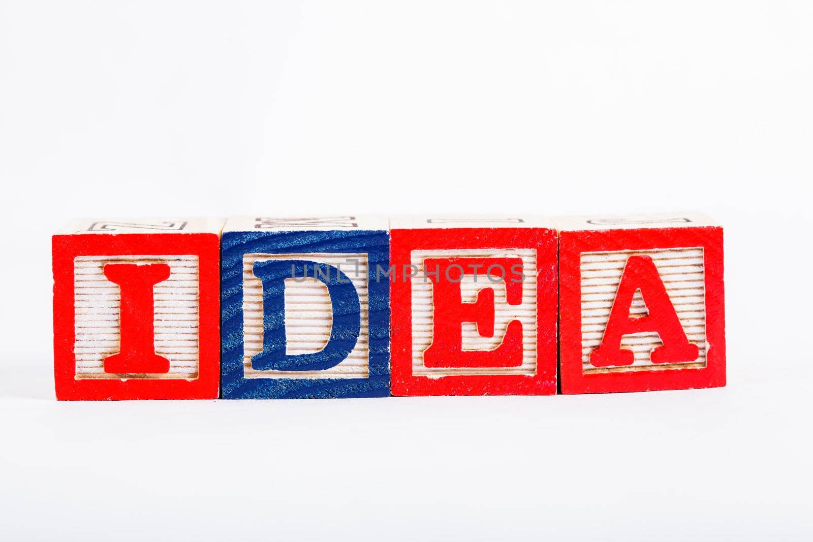 Word "idea" made from alphabet blocks on white