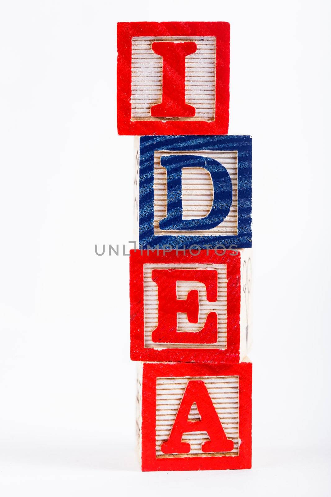 Word "idea" made from alphabet blocks on white