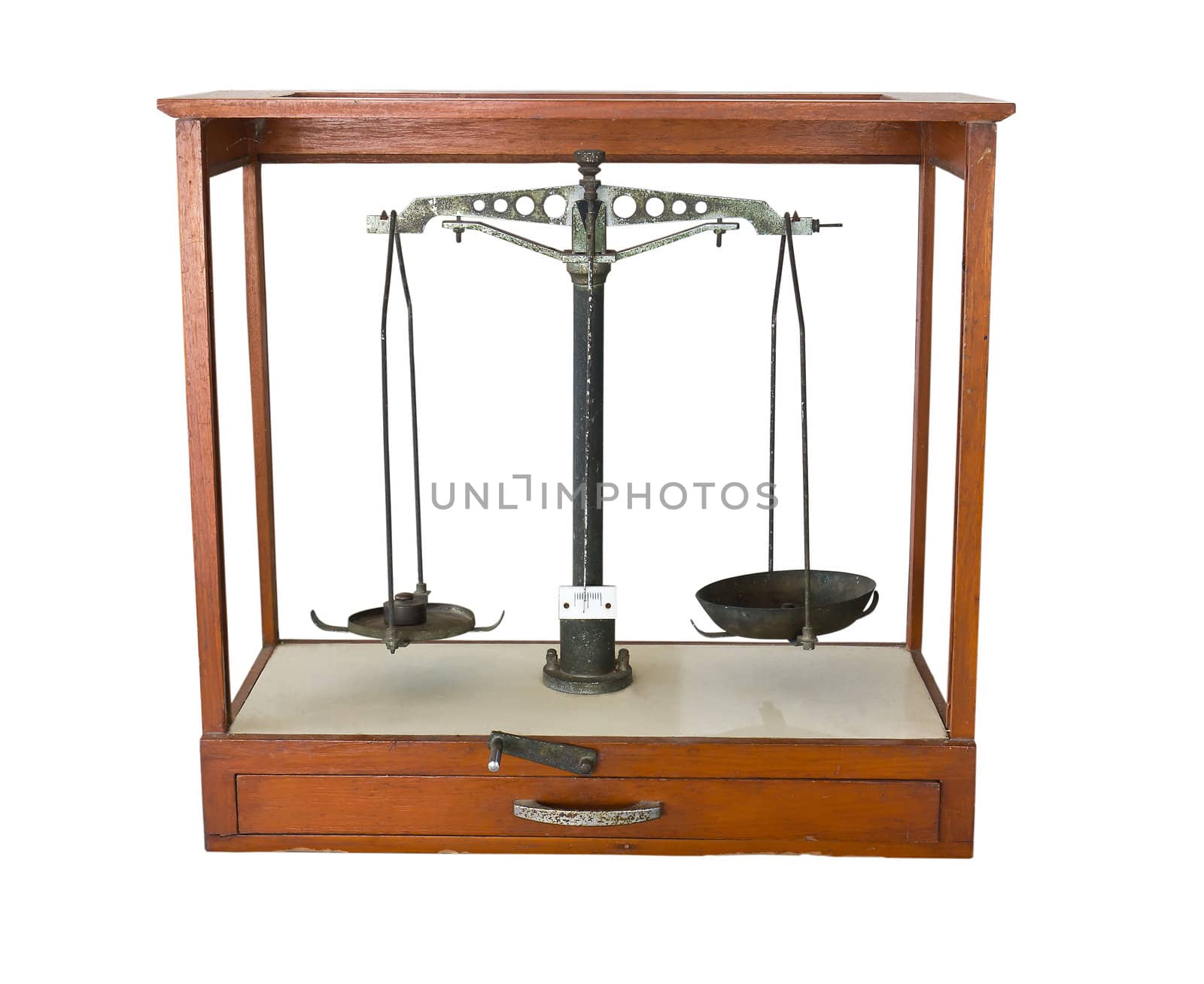 Old scales in wood cabinet on a white background