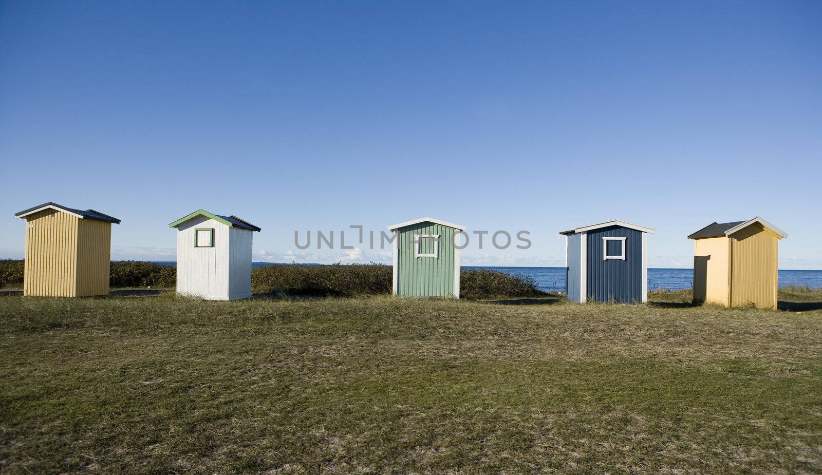 Row of boathouses on a sunny day