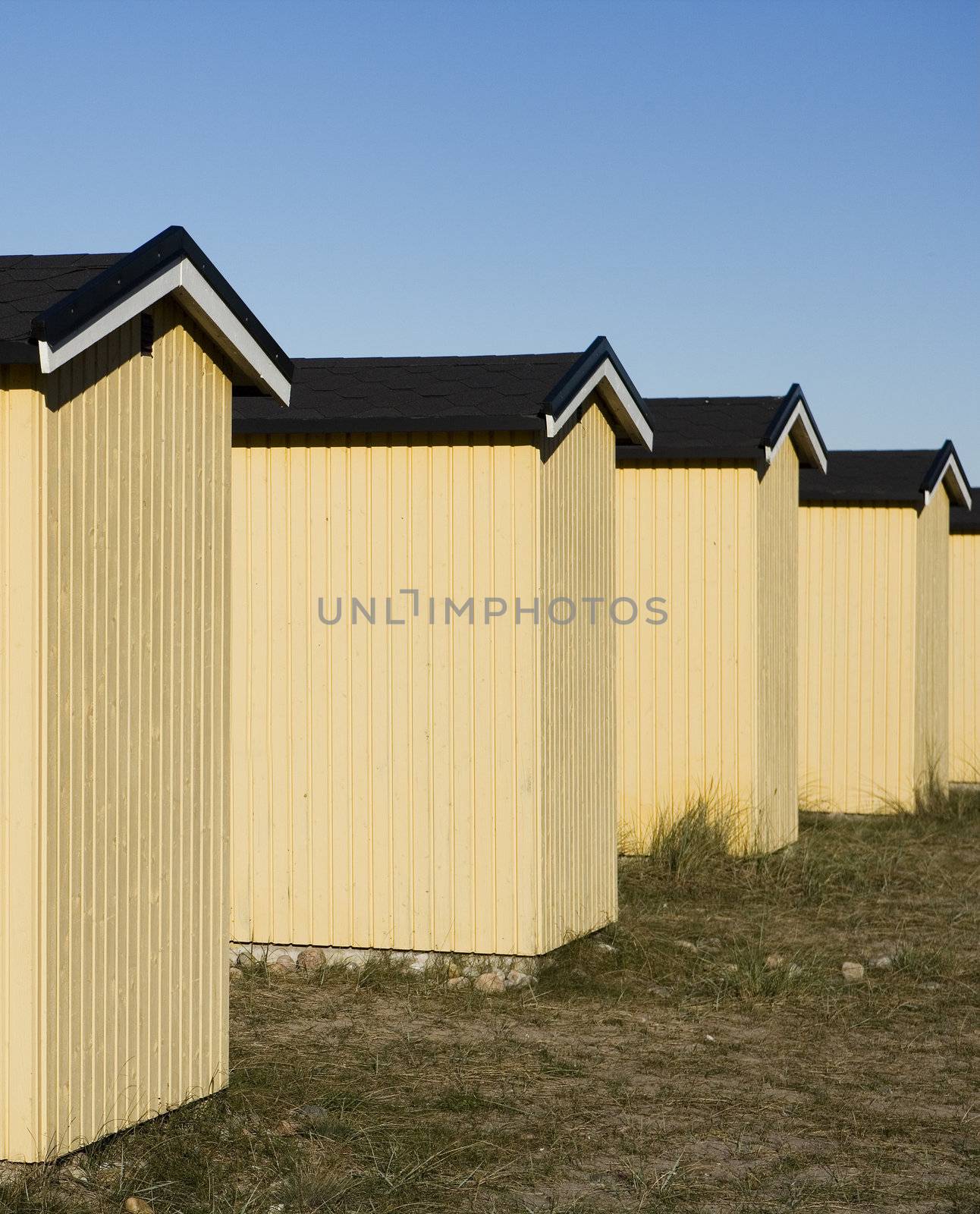 Row of boathouses on a sunny day