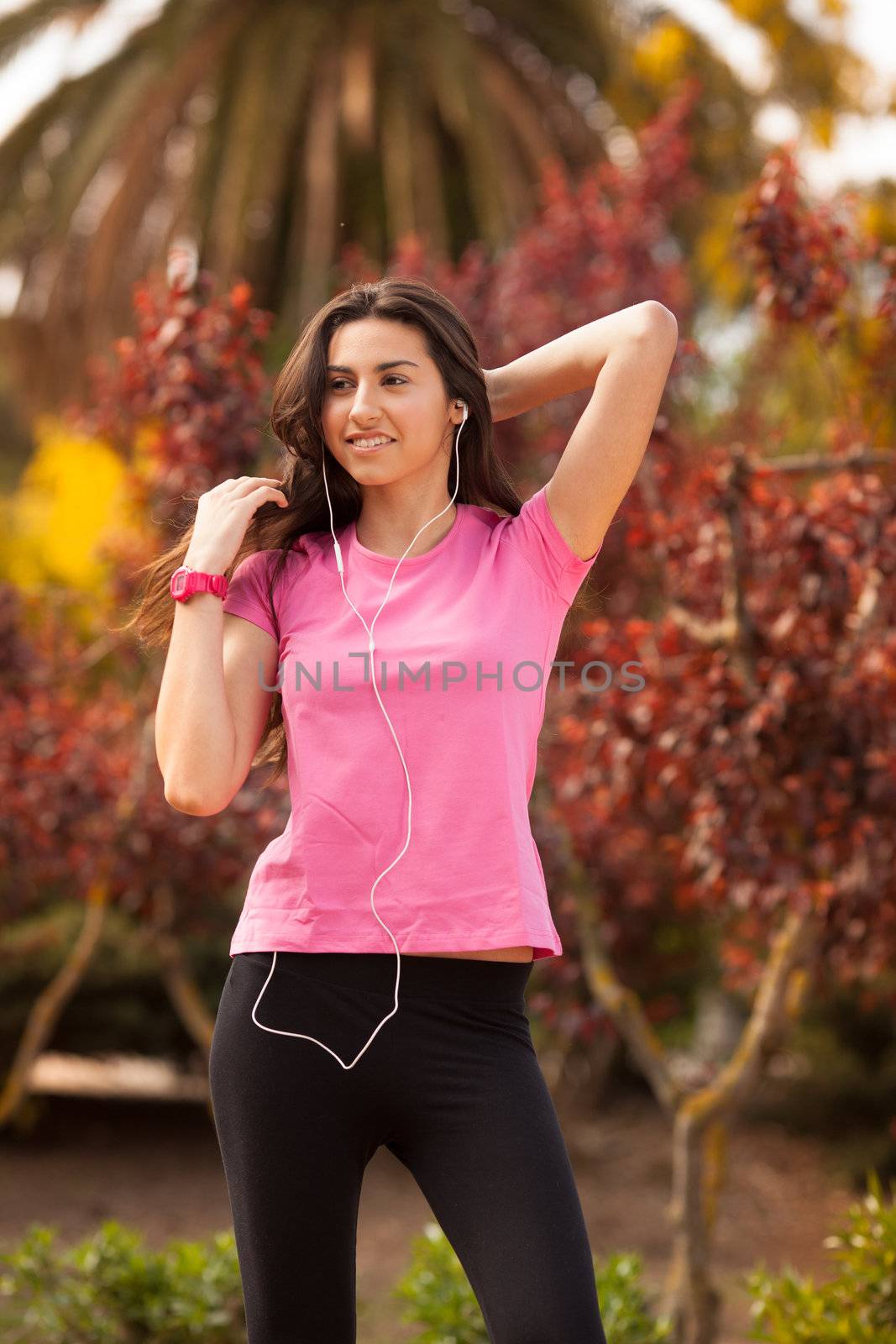 Young beautiful woman enjoying with headphones outdoors by Lcrespi