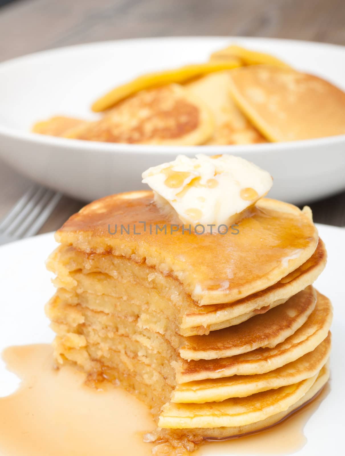 Homemade Pancakes With Butter and Warm Maple Syrup