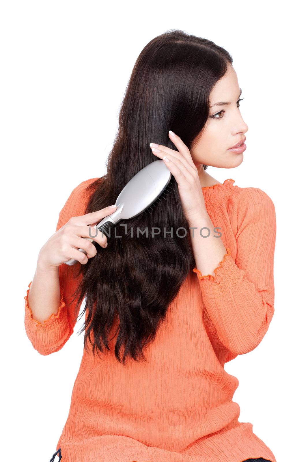 pretty woman combing her hair, isolated on white background