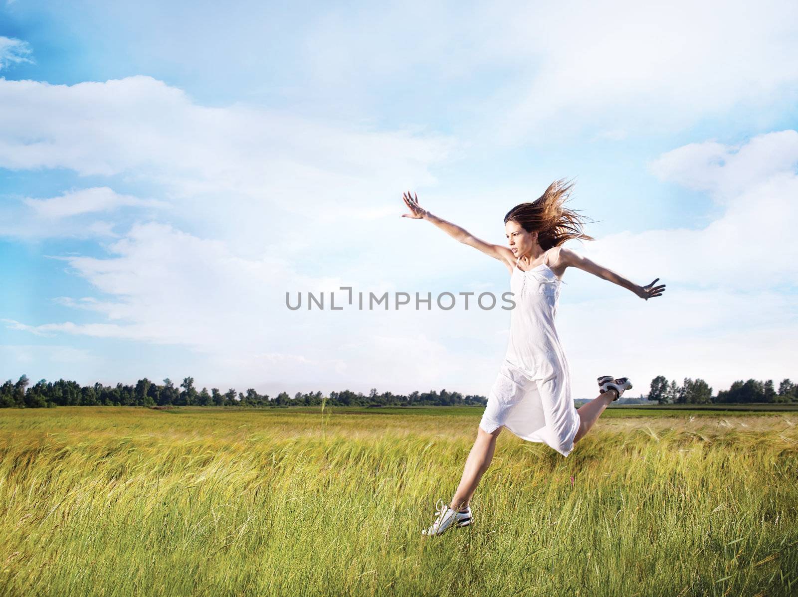 woman running across field