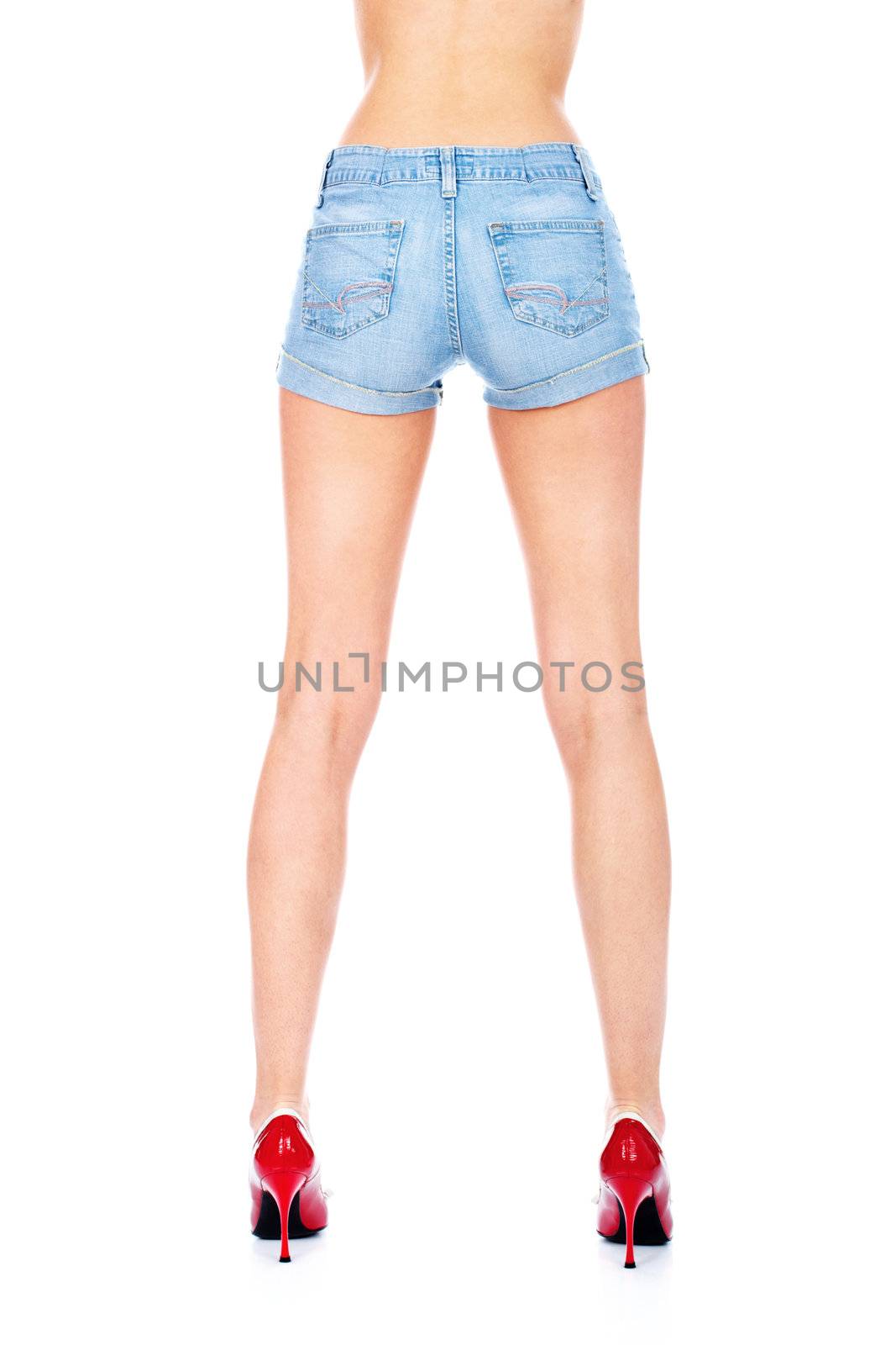 Blue shorts and woman legs in red shoes, isolated on white