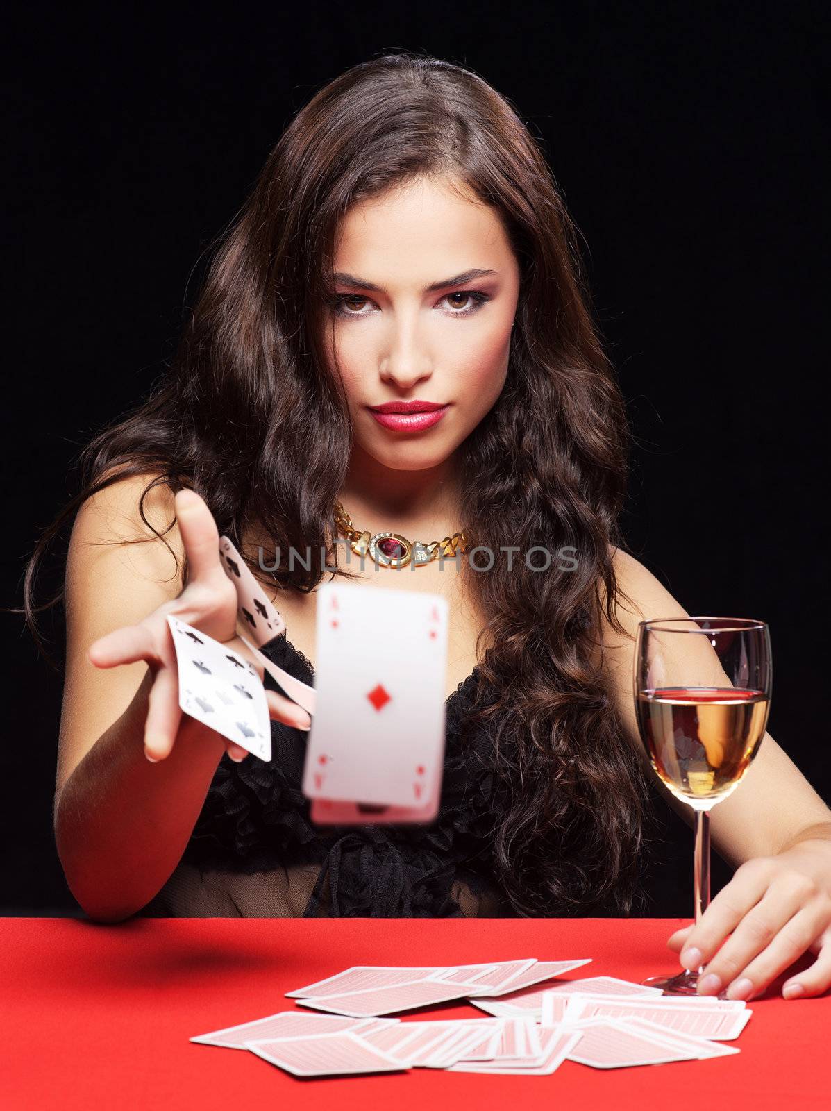 pretty young woman gambling on red table