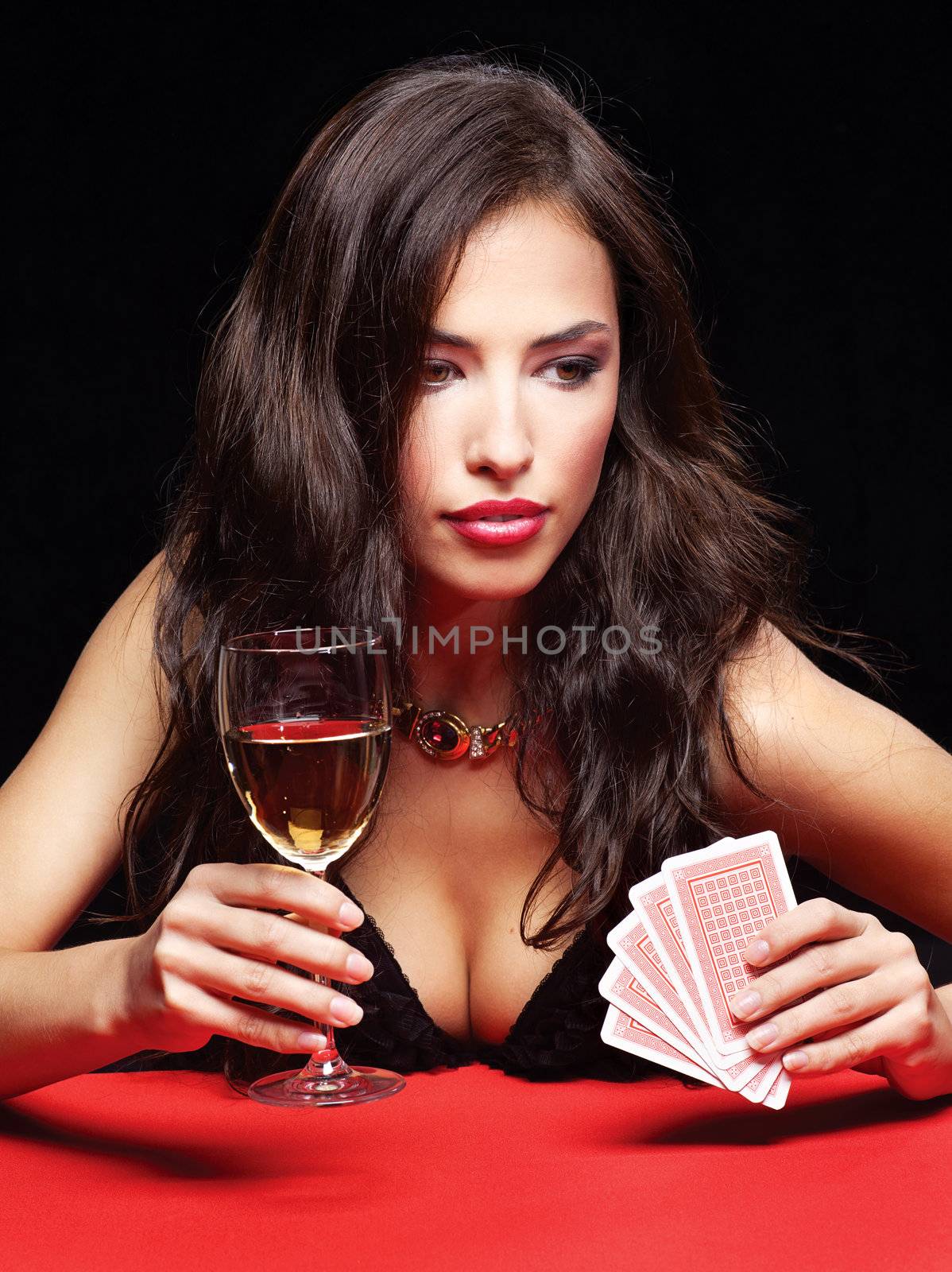 pretty woman gambling on red table by imarin