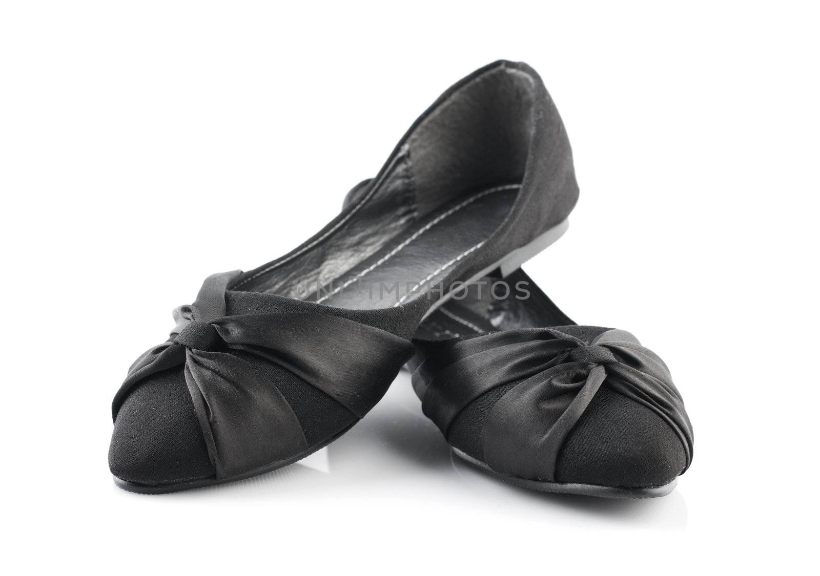 Pair of black casual woman shoes on white background
