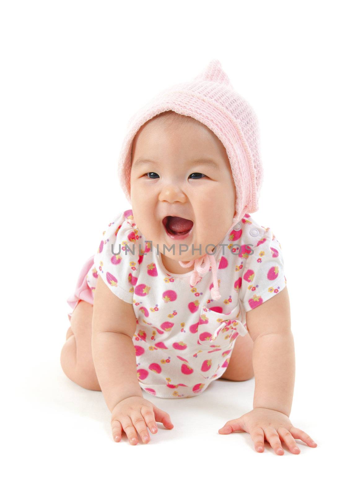 Six months old Asian mixed race baby girl crawling over white background.