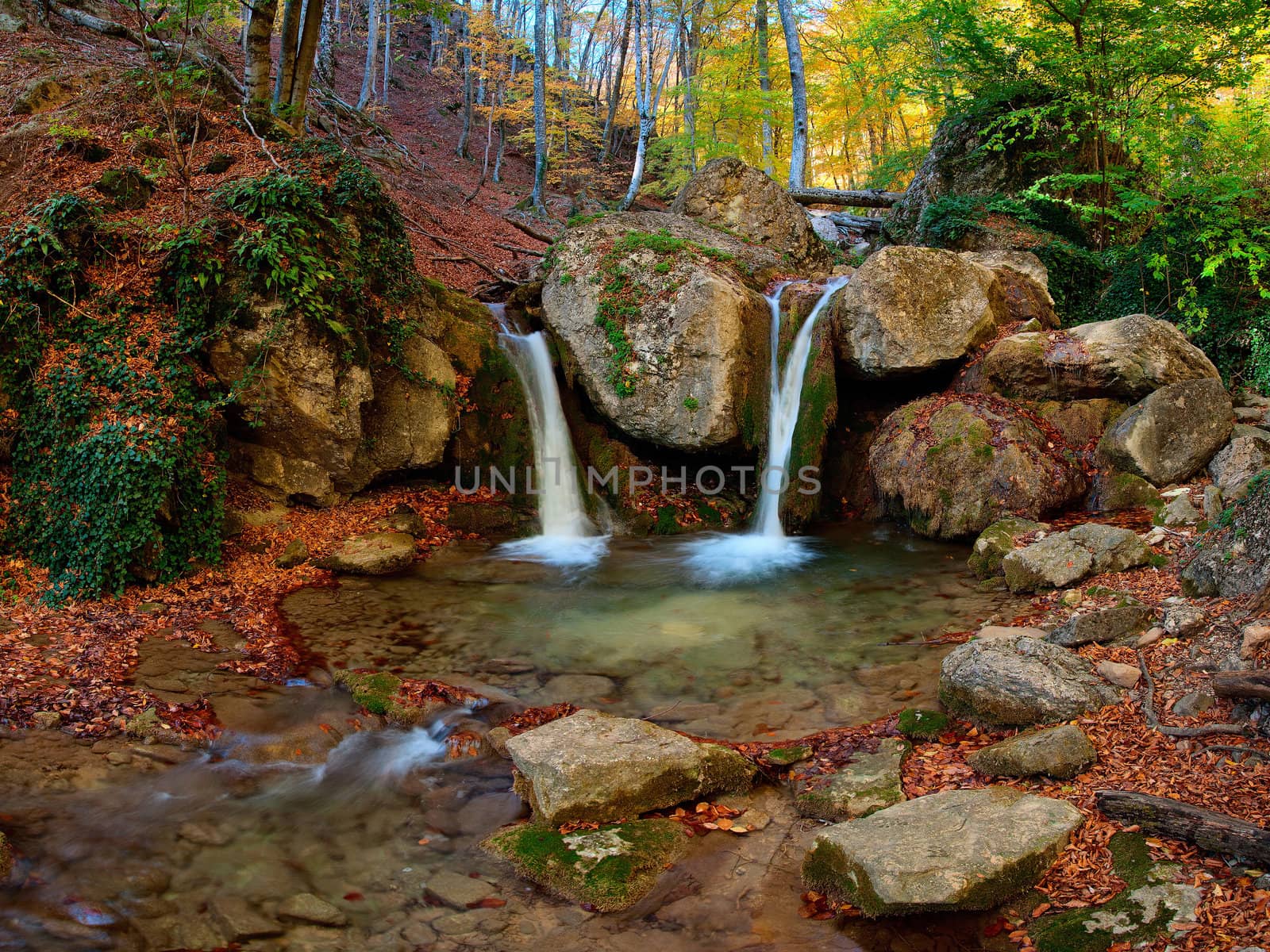 A waterfall in the mountains by firewings