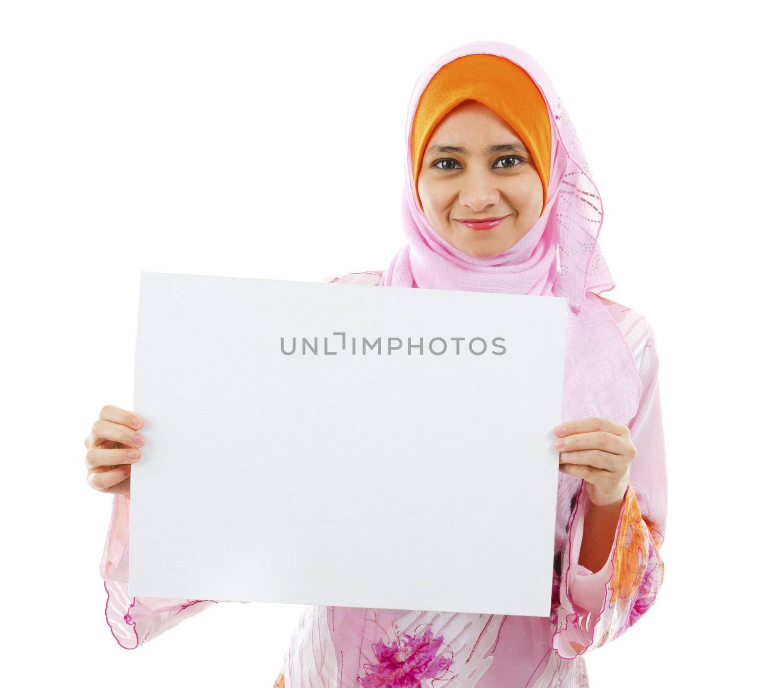 Beautiful Young Muslim girl holding a white card board over white background