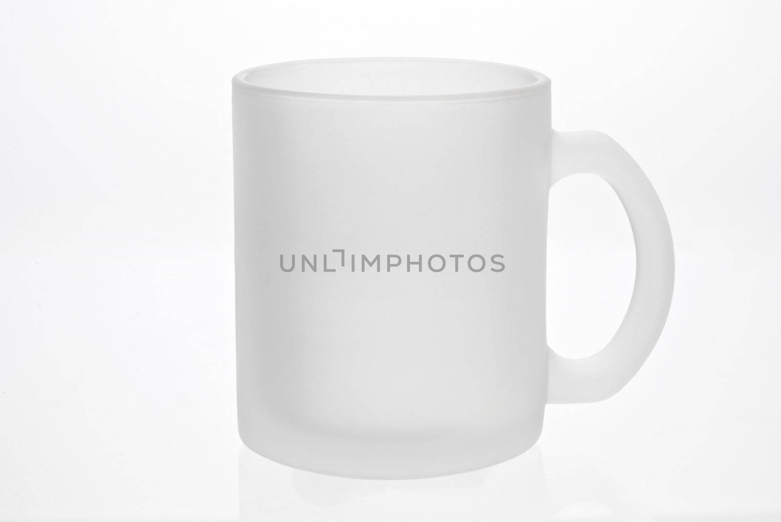 Empty white mug isolated on a white background. Matte glass. 