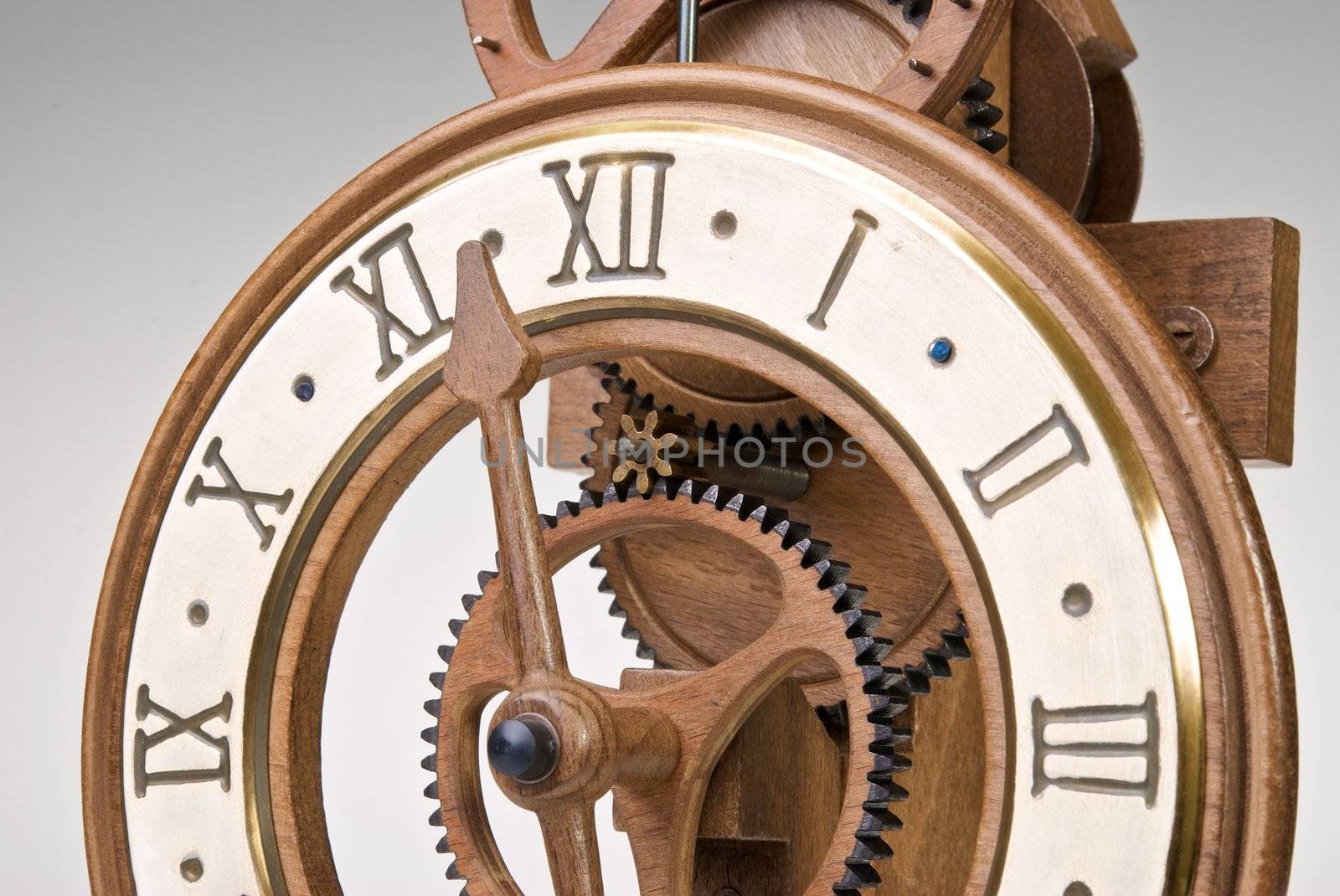 Antique looking clock dial showing time about twelve