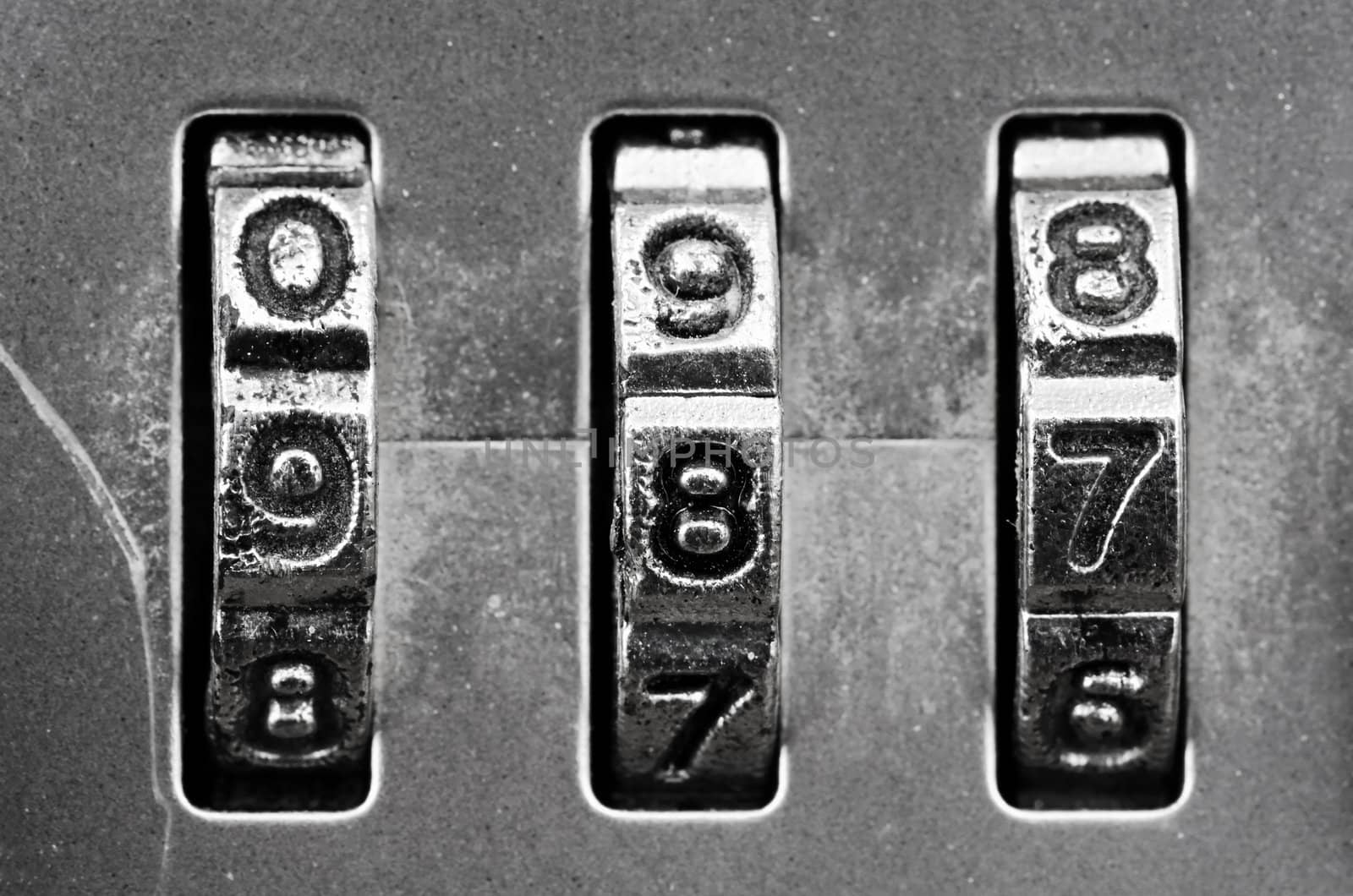 Macro of combination lock - dials set to 987,  Shallow DOF