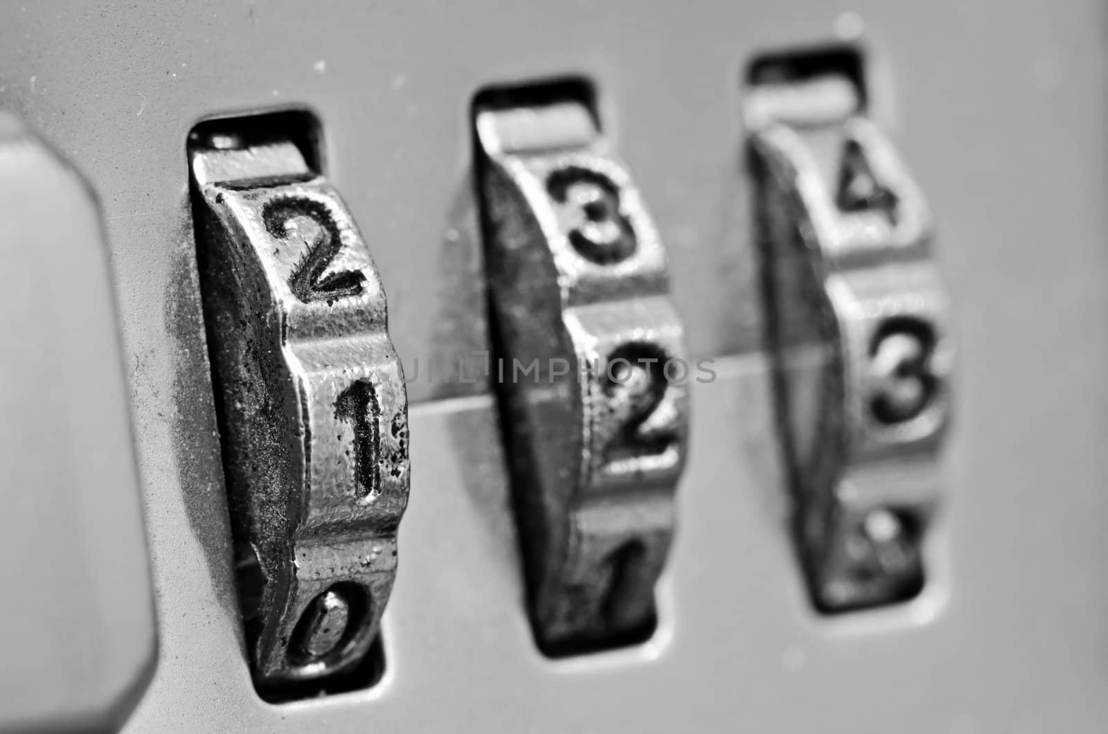 Macro of combination lock - dials set to 123,  Selective focus on first dial