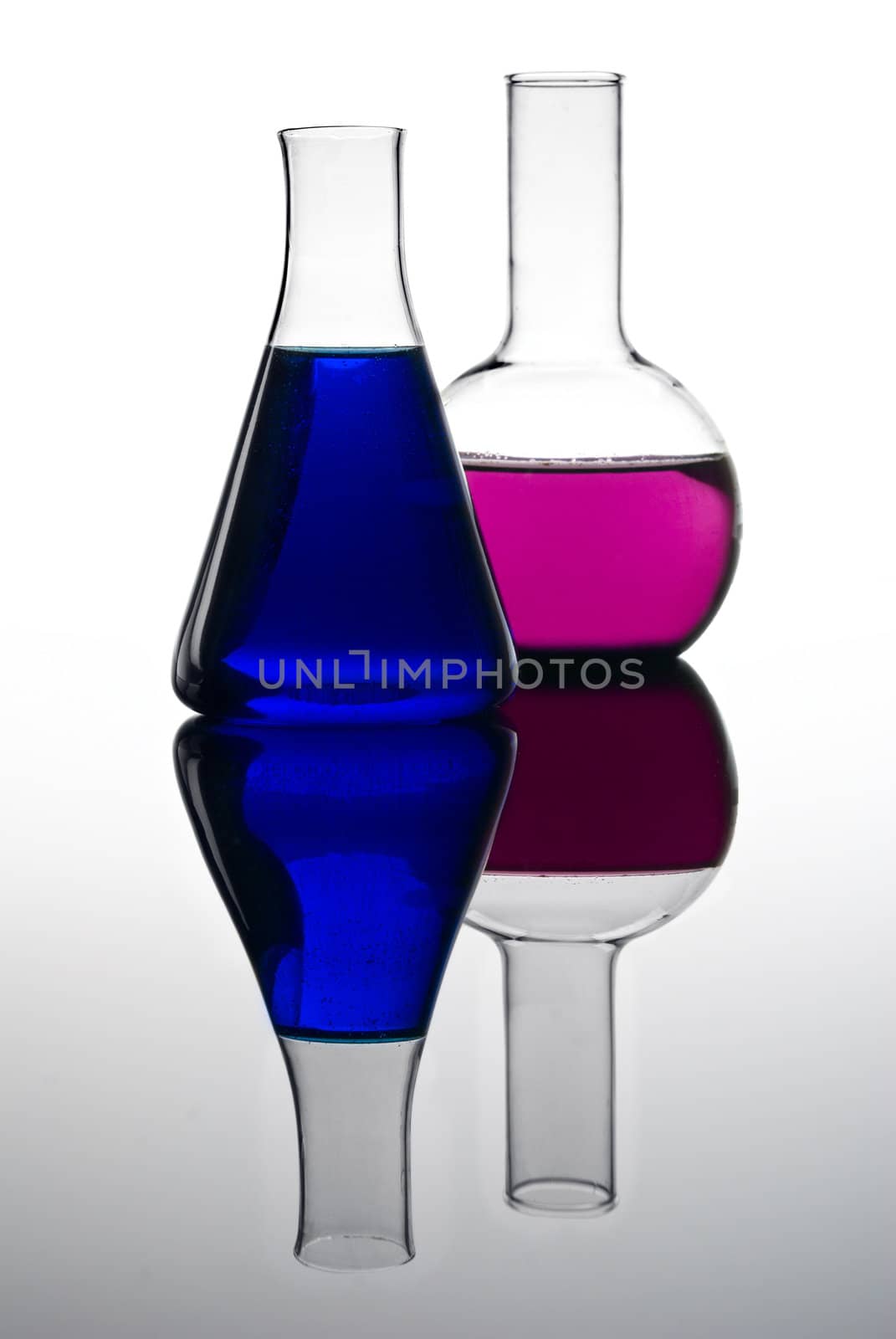 Two colorful flasks isolated on white