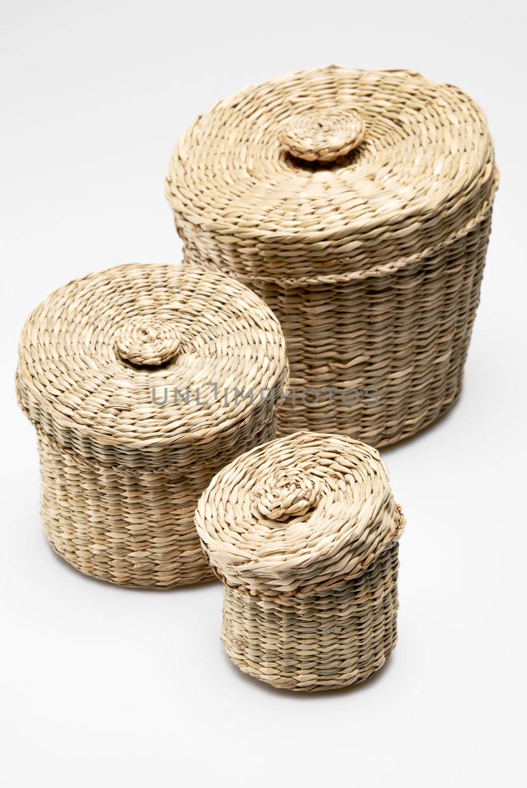 Three wattled baskets isolated on white