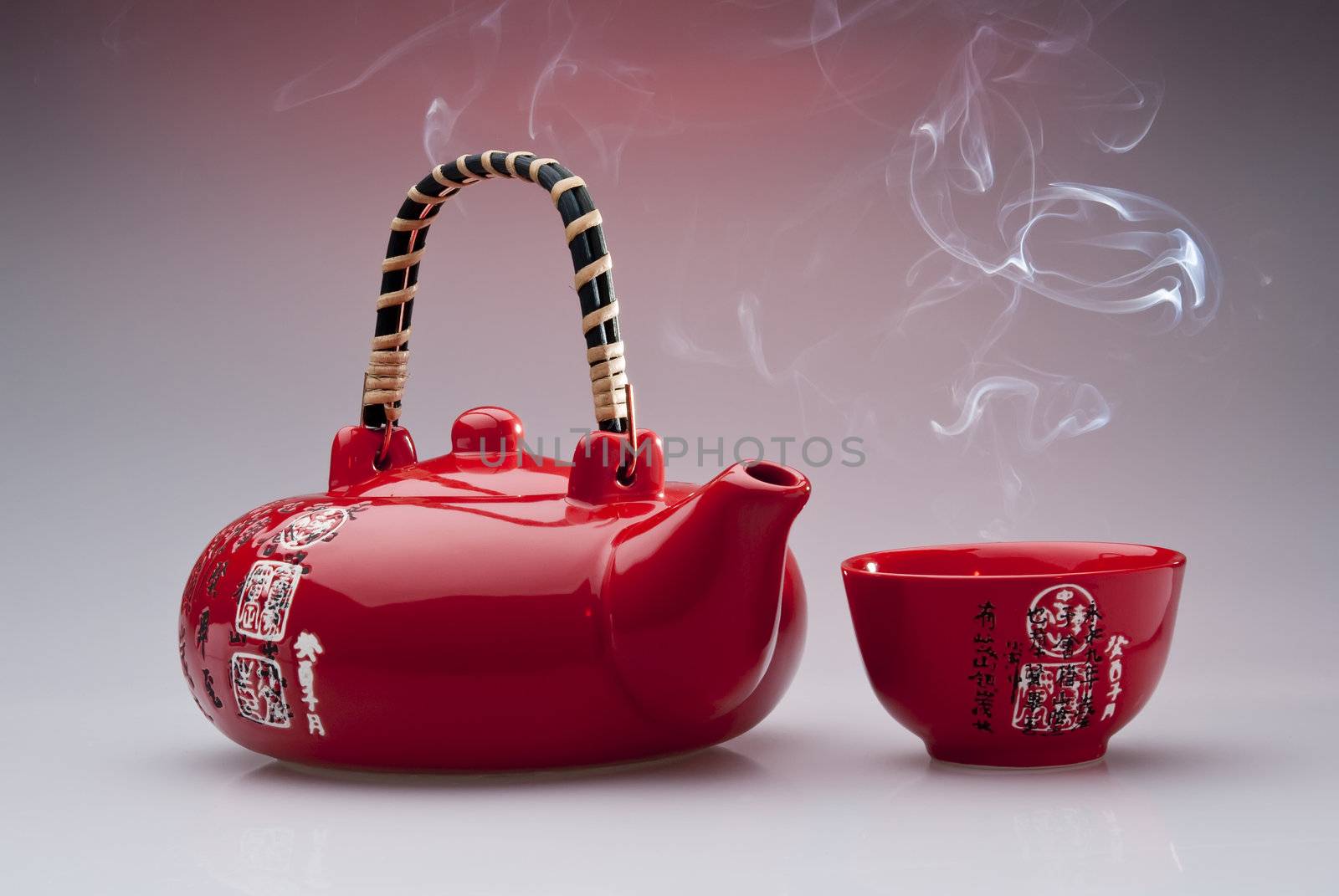 Chinese teapot with steaming cup  