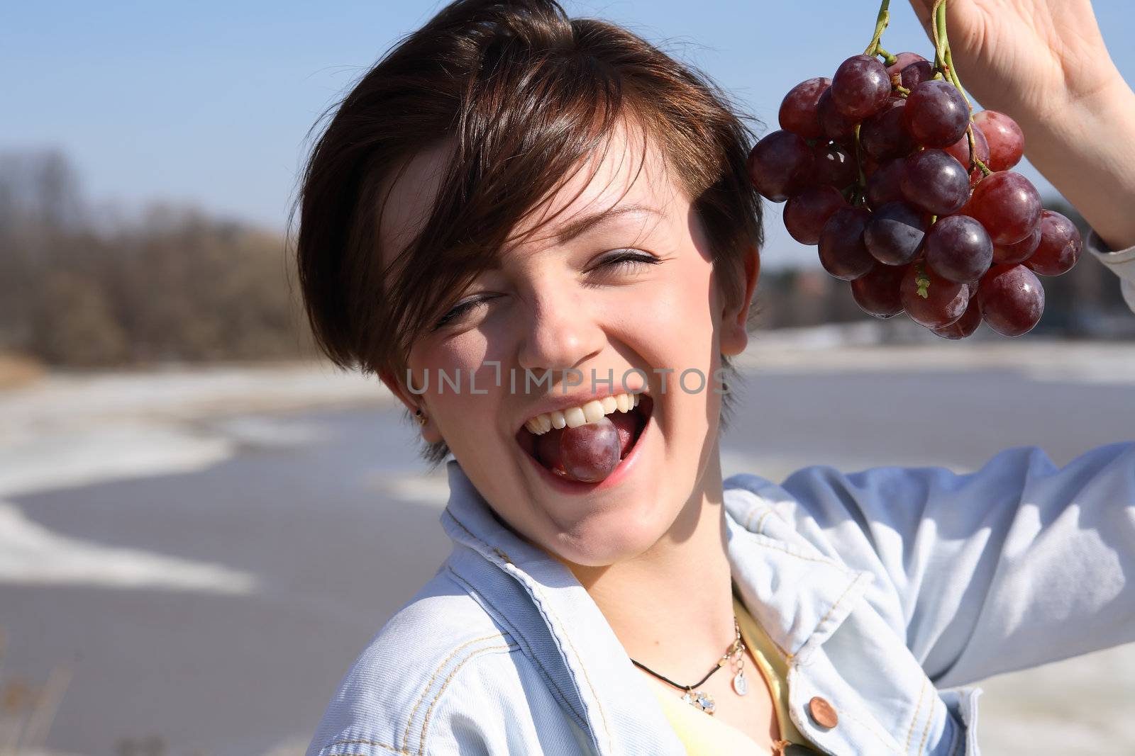 Girl Eating Grapes by kvkirillov