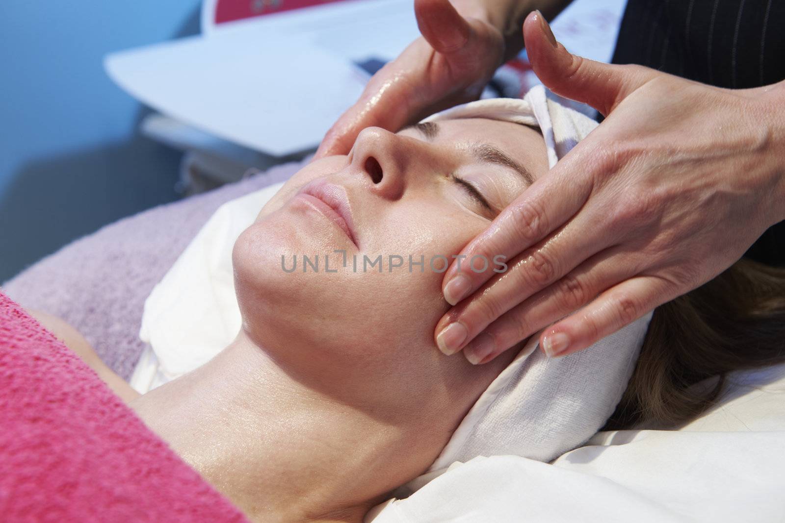 woman having a facial treatment in beauty salon