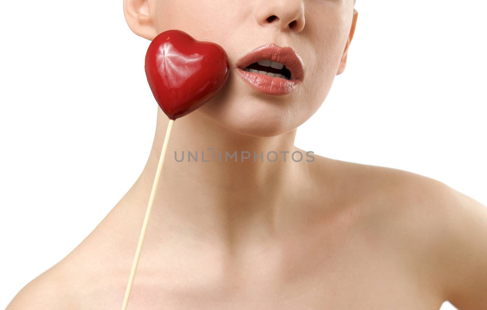 Beautiful woman holding red heart. Face closeup. Isolated on white background