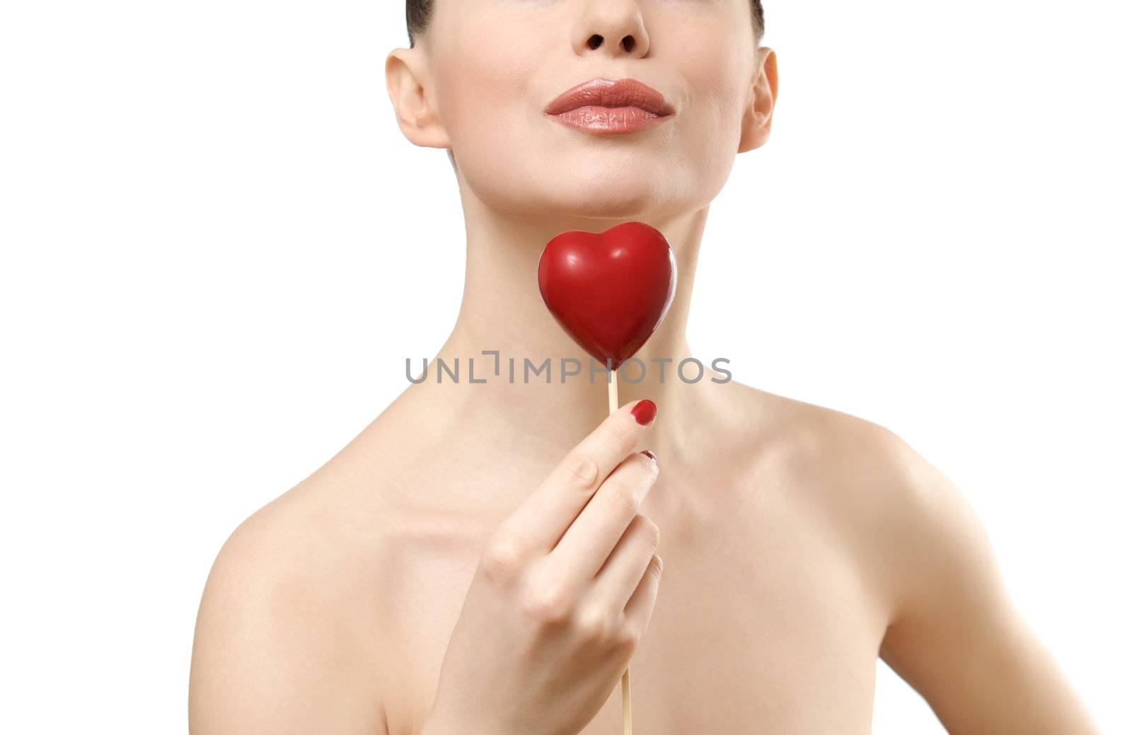 Beautiful woman holding red heart. Face closeup. Isolated on white background