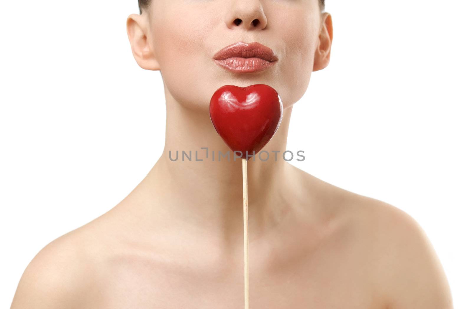 Beautiful woman holding red heart. Face closeup. Isolated on white background