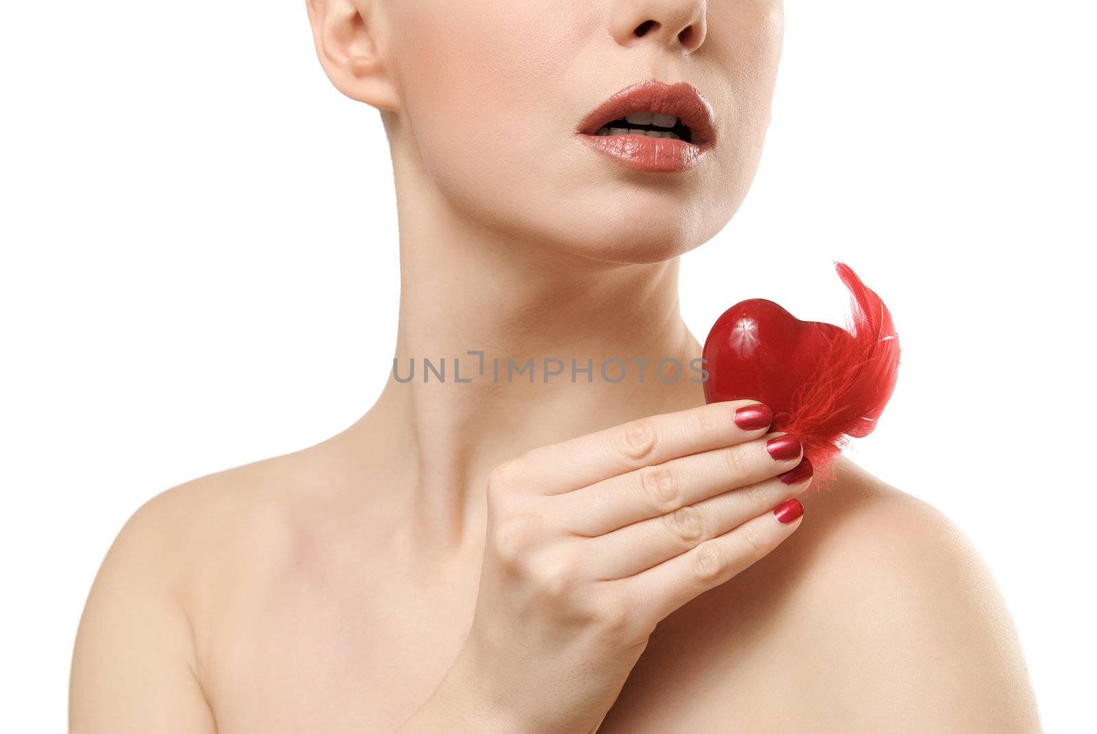 Beautiful woman holding red heart. Face closeup. Isolated on white background