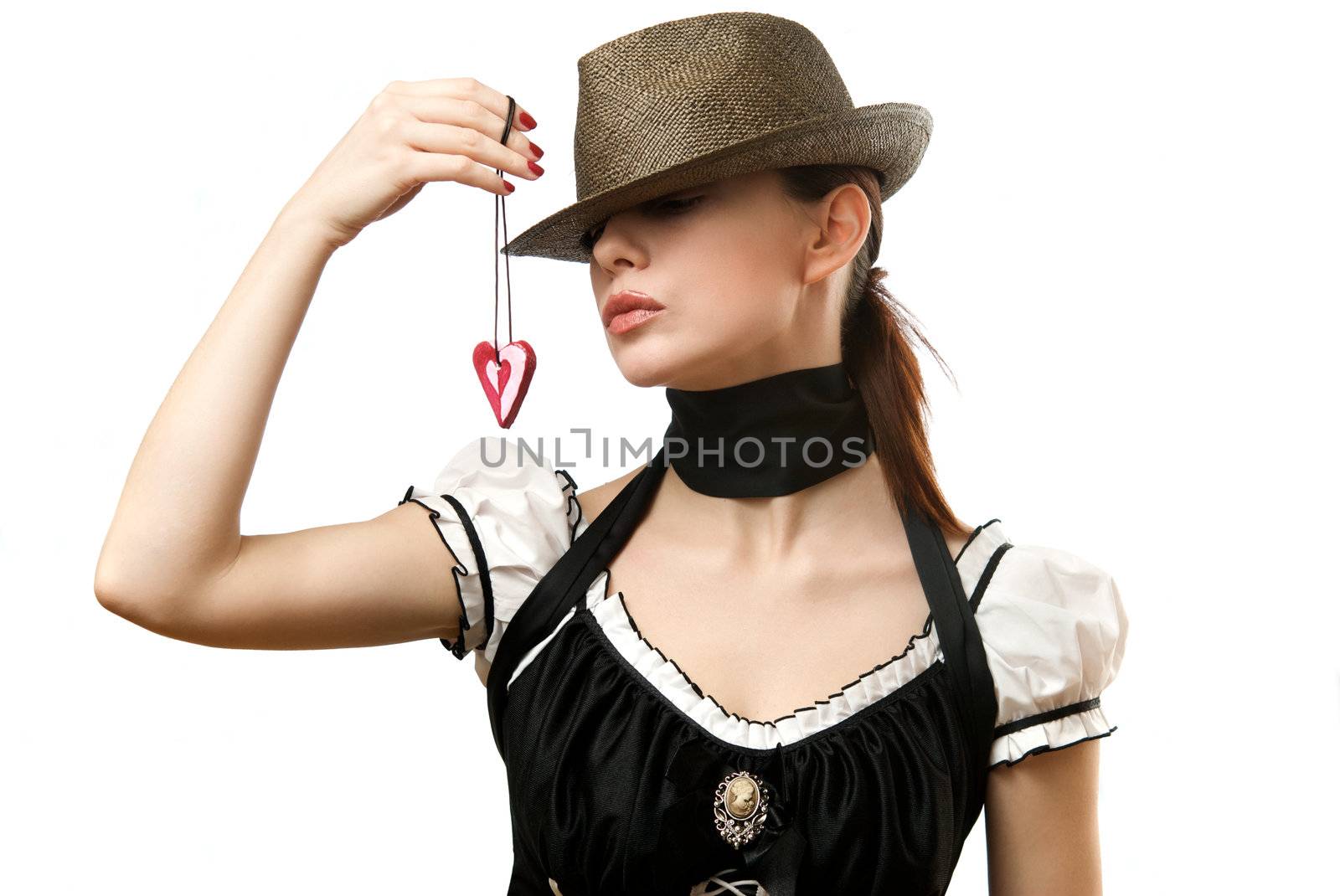 Woman wearing hat showing heart shaped pendent by kirs-ua