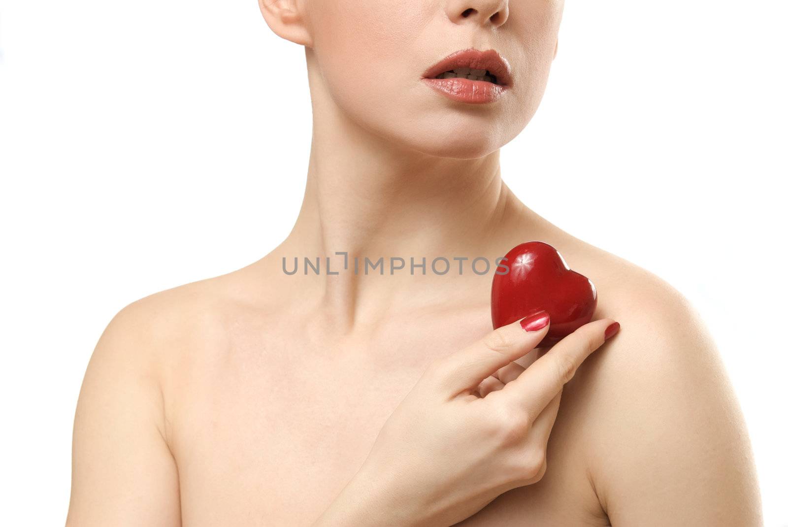 Young woman showing small heart. Isolated on white background