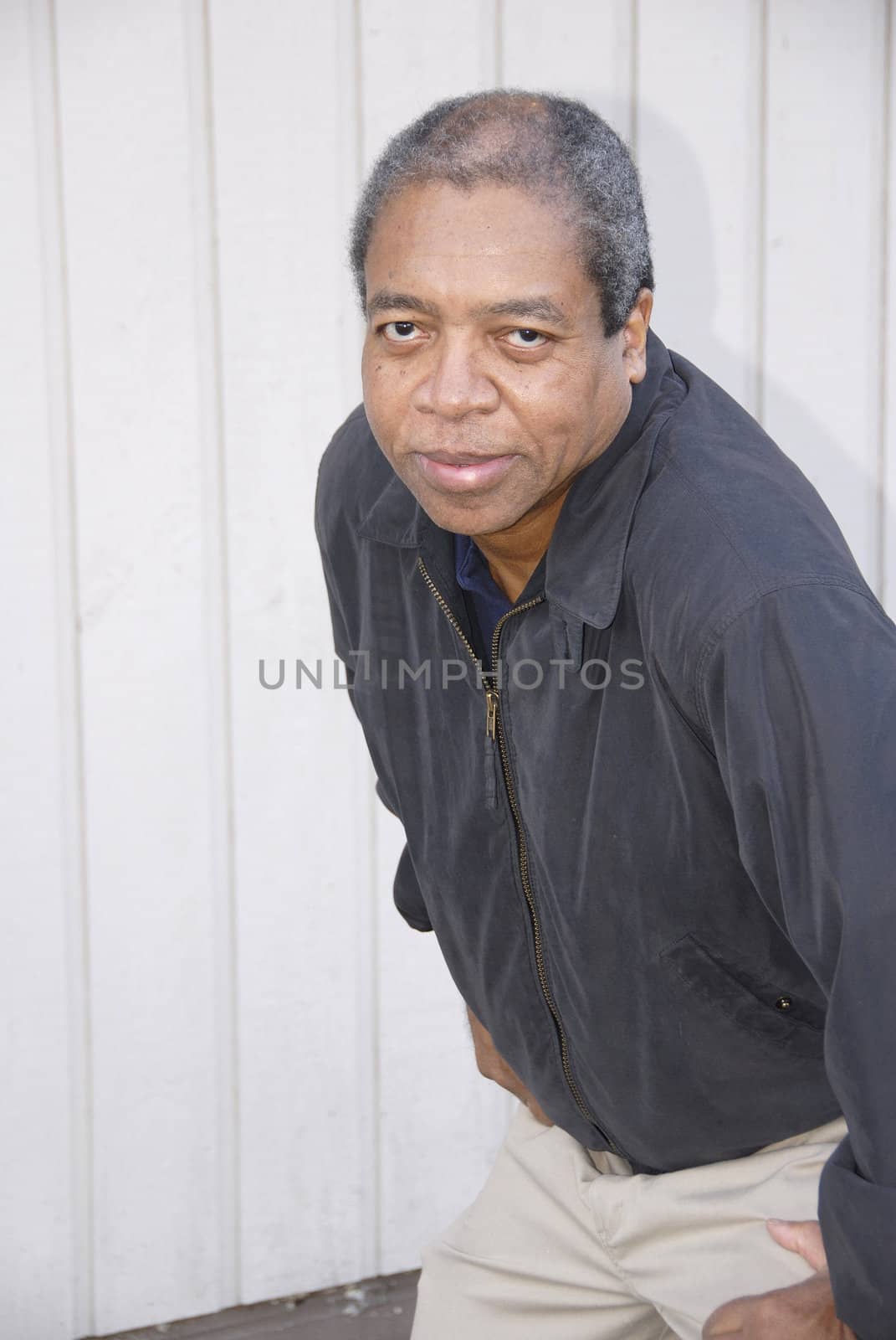 African american male posing outside.