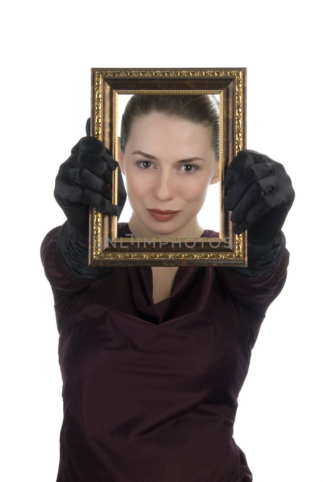 Young woman looking through picture frame