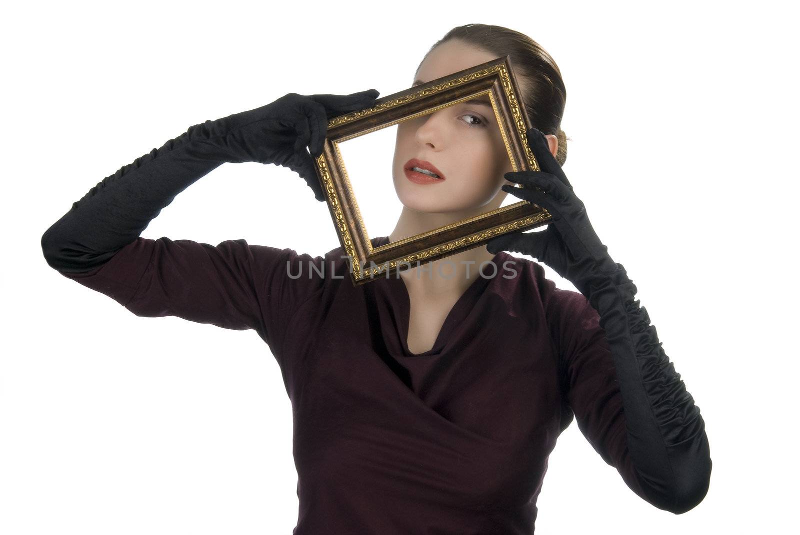 Young woman looking through picture frame