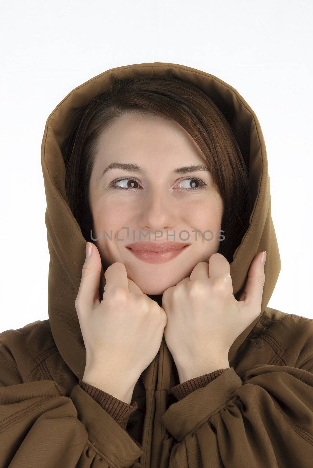 Cheerful young woman holding her hood