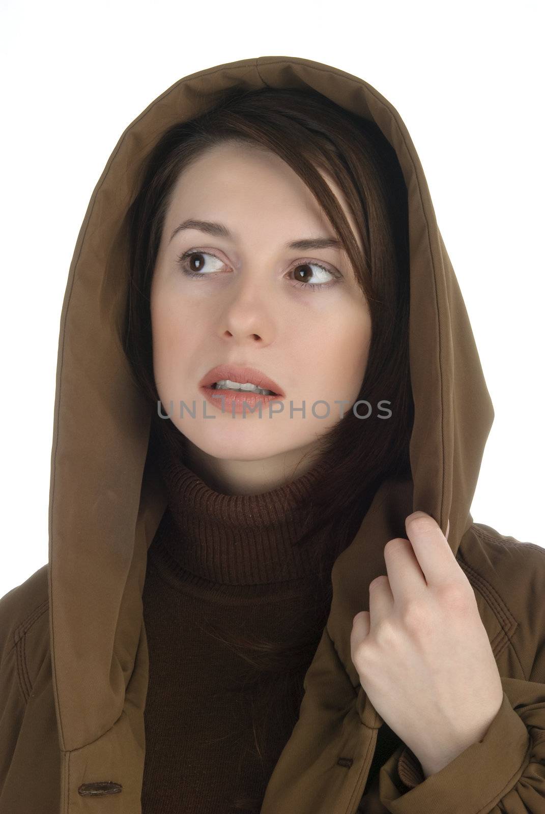 Young woman holding in had her hood