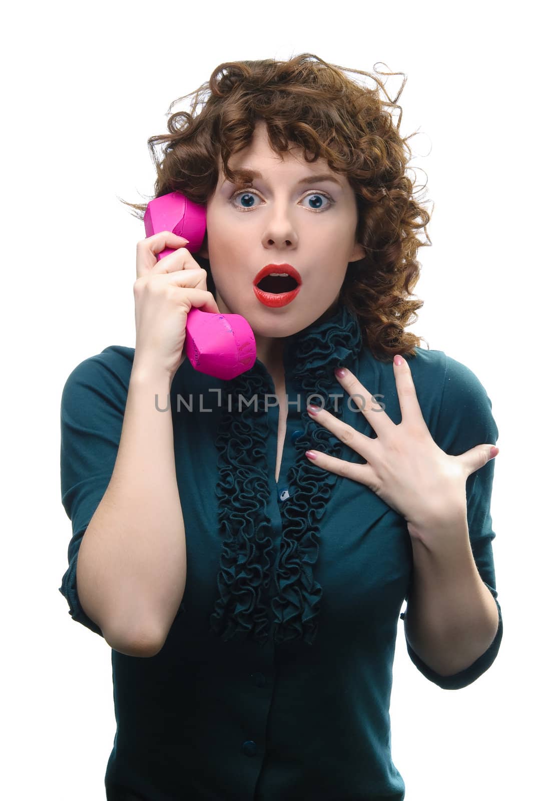 Young woman holding handset. Isolated on white